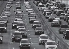  ?? ASSOCIATED PRESS ?? In this April 10 file photo, rush-hour traffic heads east (left) and west (right) along the Schuylkill Expressway in Philadelph­ia.