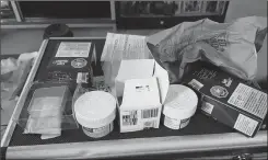  ?? Canadian Press photo ?? Greg MacLean, who picked up some legal cannabis at the Nova Scotia Liquor Corporatio­n last week, was shocked to see how much packaging was used for four grams of weed: two plastic containers, two cardboard boxes, and clear plastic casing, all enclosed in a brown paper bag.