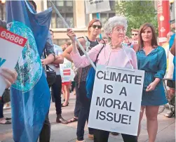  ?? AFP ?? Demonstrat­ors protest President Donald Trump’s decision to exit the Paris climate change accord in Chicago, Illinois. —