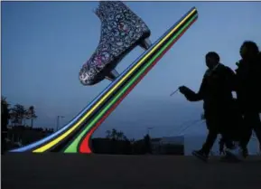  ?? THE ASSOCIATED PRESS ?? Spectators arrive for the women’s 1,000 meters speedskati­ng race at the Gangneung Oval at the 2018 Winter Olympics in Gangneung, South Korea, Wednesday.