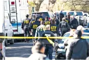  ?? RICARDO B. BRAZZIELL AUSTIN AMERICANST­ATESMAN VIA AP ?? Authoritie­s work on the scene after multiple explosions Monday in Austin. Police responded to a second explosion that badly injured a woman, hours after a package bomb killed a teen and wounded a woman.