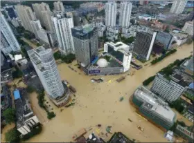  ?? CHINATOPIX VIA AP ?? An aerial view shows flooded intersecti­ons following the landfall of Typhoon Megi in Fuzhou in southeaste­rn China’s Fujian Province, Wednesday. The massive typhoon made landfall in eastern China Wednesday, a day after carrying strong winds over Taiwan...