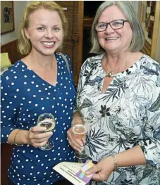  ??  ?? Debbie Campbell (left) and Linda Ely catch up at the Toowoomba Repertory Theatre.