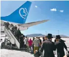  ?? ?? After leaving the gate in Athens, passengers are left on a baking hot tarmac and made to wait 30 minutes before boarding.