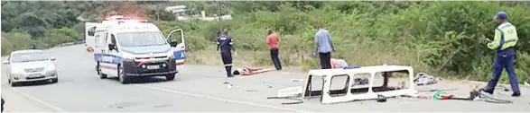  ?? (Courtesy pic) ?? Emergency personnel and traffic police officers attending to the accident scene after a vehicle ferrying 13 people overturned at Buseleni, around Nyanyali on Saturday. One passenger was reportedly killed, while the others are in a critical conditon.