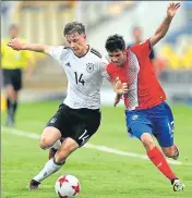  ?? GETTY ?? Yannik Keitel of Germany battles for the ball with Jose Alfaro of Costa Rica during their FIFA U17 World Cup match in Goa.