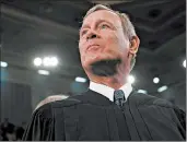  ?? LEAH MILLIS/AP ?? Chief Justice John Roberts wrote that limits on church attendance “appear consistent” with the First Amendment.