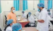  ?? HT PHOTO ?? Chief minister Yogi Adityanath interactin­g with a doctor at the Covid Centre in the district magistrate's office in Ghaziabad on Sunday.