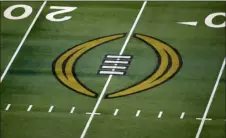  ?? ROGER STEINMAN — THE ASSOCIATED PRESS FILE ?? The College Football Playoff logo is shown on the field at AT&T Stadium before the Rose Bowl game between Notre Dame and Alabama in Arlington, Texas, on Jan. 1, 2021.