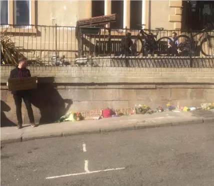  ??  ?? Campaigner­s left tributes outside a Renfrew Street hotel after an asylum seeker’s death