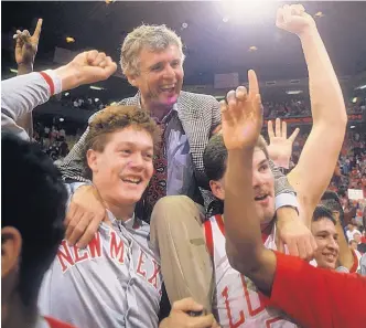  ?? GREG SORBER/JOURNAL FILE ?? New Mexico coach Gary Colson is carried off the court by Luc Longley, left, and Rob Loeffel after the team’s upset victory over top-ranked Arizona in the Pit on Jan. 2, 1988.