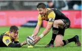  ??  ?? Ill-health saw Beauden Barrett, right, excused from Hurricanes training yesterday.