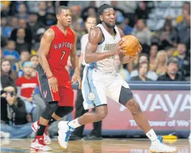  ??  ?? Nuggets forward Kenneth Faried, right, in action against the Toronto Raptors.