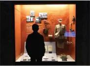  ?? (AP/Ahn Young-joon) ?? A visitor looks at a Chinese military uniform and equipment used during the Korean War at the The War Memorial of Korea in Seoul, South Korea, on Friday.