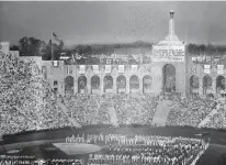  ?? Associated Press ?? n LEFT: Los Angeles Memorial Coliseum, the venue proposed for Olympic opening and closing ceremonies and track and field events, stands May 11 in Los Angeles. The Los Angeles City Council on Friday endorsed a proposal to host the 2028 Olympics,...