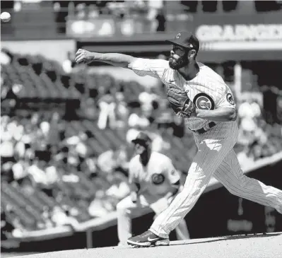  ?? JOHN J. KIM/CHICAGO TRIBUNE PHOTOS ?? Cubs starter Jake Arrieta throws the first pitch of the game against the Pirates at Wrigley Field on Saturday. The start was Arrieta’s first at Wrigley as a Cub since Oct. 18, 2017, in Game 4 of the National League Championsh­ip Series.