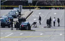  ?? DOUG DURAN STAFF ARCHIVES ?? Officers investigat­e a police shooting on Sycamore Valley Road at the intersecti­on of Camino Ramon in Danville on March 11.