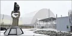  ?? SERGEI SUPINSKY/AFP ?? Chernobyl’s New Safe Confinemen­t covers the destroyed fourth block of the Chernobyl nuclear power plant after it was installed yesterday.