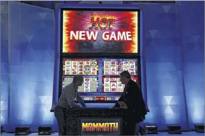  ?? JOHN LOCHER / AP ?? As new forms of gambling are considered in the months leading up to the 2016 legislativ­e session, it’s a safe bet Georgia and its leaders will see enough glitz and showmanshi­p worthy of the flashiest casino in Las Vegas.
