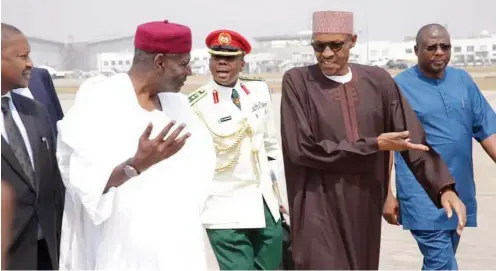  ??  ?? President Muhammadu Buhari (right) with his Chief of Staff, Malam Abba Kyari, shortly before the president’s departure from Abuja for London to begin part of his annual vacation yesterday Photo: