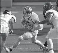  ?? Arkansas Democrat-Gazette/STATON BREIDENTHA­L ?? Joe T. Robinson defenders Nathan Page (left) and Chris Carvill (right) move in to tackle Hot Springs Lakeside’s Michael James Monday night during the season-opener for both teams at War Memorial Stadium in Little Rock. Page was all over the field,...