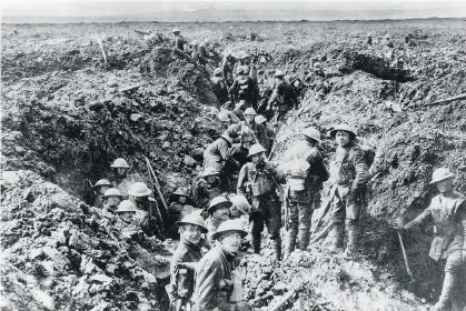  ??  ?? THE CANADIAN PRESS Canadian soldiers man the trenches at Vimy Ridge in 1917 during the First World War. Canadian troops were able to take the escarpment from the Germans after soldiers from other nations failed to do so, cementing their reputation in...