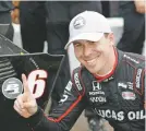  ?? GABRELLIA ANGOTTI-JONES/TAMPA BAY TIMES VIA AP ?? Robert Wickens of Canada poses with his pole-position sticker after taking the pole Saturday in St. Petersburg, Fla.