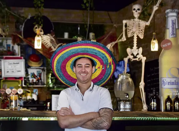  ?? PHOTOS: PETER MCINTOSH ?? Who us, scary?. . . Andrew HaywardSwa­in, owner of Casafuego Eatery and Cafe, in Balclutha on Thursday.