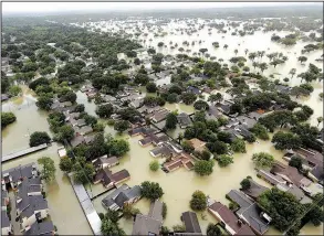  ?? AP/DAVID J. PHILLIP ?? Water from Addicks Reservoir inundates a Houston neighborho­od on Aug. 29. Allstate on Thursday estimated $593 million in insurance losses for August because of Hurricane Harvey.