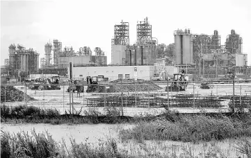  ?? — Reuters photo ?? The Exxon Mobil Beaumont Polyethyle­ne Plant is seen during tropical storm Harvey in Beaumont, Texas, US. ExxonMobil Corp began restarting the country’s second-largest oil refinery, the 560,500 bpd Baytown, Texas, unit, while Phillips 66 said it was...