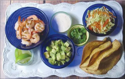  ?? Sara Moulton via AP ?? Ingredient­s for crispy shrimp tacos with cole slaw and chipotle cream.This dish is from a recipe by Sara Moulton.