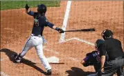  ?? CURTIS COMPTON/CURTIS.COMPTON@AJC.COM ?? Outfielder Drew Waters hits a two-run double to give the Braves a 4-0 lead over the Twins in their spring training matchup Friday.