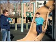  ?? NWA Democrat-Gazette/BEN GOFF • @NWABENGOFF ?? Tonya Bibrowicz watches Dec. 21 while her son, Branden Bibrowicz, 5, of Springdale plays at Dave Peel Park.