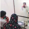 ?? Supplied ?? Dr. Ehsan communicat­es with his patients using cell phones.