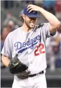  ?? | MATT SLOCUM/ AP ?? Dodgers ace Clayton Kershaw adjusts his hat after giving up the first grand slam of his career.
