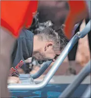  ?? Ellen Schmidt Las Vegas Review-journal @ellenkschm­idt_ ?? Former UNLV athlete Chase Skenandore does pushups at the new outdoor fitness court that was dedicated by the National Fitness Campaign on Jan. 28.