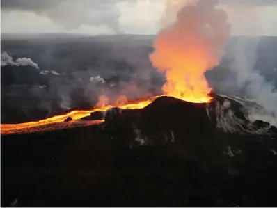  ?? Associated Press ?? ■ In this July 14 photo provided by the U.S. Geological Survey, lava from Kilauea volcano erupts in the Leilani Estates neighborho­od near Pahoa, Hawaii. On Thursday, government scientists updated 18 U.S. volcanoes as a “very high threat” because of what’s been happening inside them and how close they are to people.