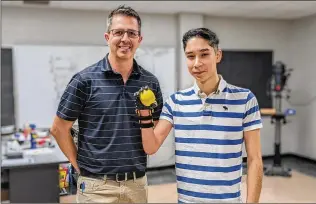  ?? COURTESY OF KELLY FLOOD ?? Sergio Peralta, whose right hand didn’t fully develop, received a prosthetic hand by way of a class assignment from high school engineerin­g teacher Jeff Wilkins.