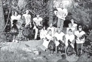  ?? B18twe02 ?? Last week, being National Spring Clean Week, the Arran Crusaders and Lamlash Cubs joined together to clean up over 21 bags of rubbish from the Whitehouse woods in Lamlash.