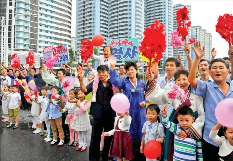  ?? REUTERS ?? North Koreans are seen welcoming members who contribute­d to the success of the hydrostati­c test for interconti­nental ballistic rockets by Pyongyang. This undated photo was released by North Korea’s Korean Central News Agency (KCNA) in Pyongyang on Wednesday. via