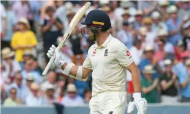  ??  ?? Jack Leach raises his bat as he makes his way back to the pavilion. Photograph: Graham Hunt/ProSports/Rex/Shuttersto­ck