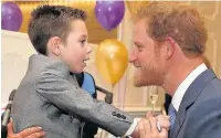  ??  ?? Ollie with Prince Harry at the WellChild Awards