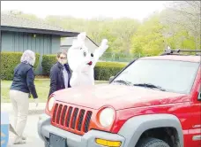  ?? File photo ?? A curbside Easter Bunny waves to POA members during the first-ever curbside POA Easter Egg Hunt April 2020.