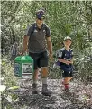  ??  ?? Te Amaroa Clifton and son Manawanui help carry the ducks.