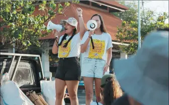  ?? REUTERS ?? Indonesian environmen­talists Isabel Wijsen, 17, and Melati Wijsen, 19, speak from the back of a pickup truck during Bali’s Biggest Clean- Up 2020 in Petitenget Beach, Seminyak, in February.