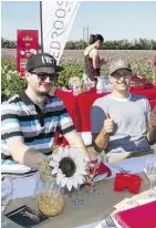  ?? SHIRLEY BARG ?? Enjoying a small pre-Feast on the Field sponsors and VIP’s dinner last week in a potato field near Stony Plain are Peter Keith of Meuwly’s Artisan Food Market and Charles Turanich-Noyen.