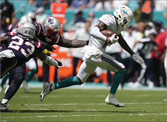  ?? REBECCA BLACKWELL — THE ASSOCIATED PRESS ?? Miami Dolphins wide receiver Jaylen Waddle runs for a touchdown during the first half of a Sept. 11 win over the New England Patriots in Miami Gardens, Fla.