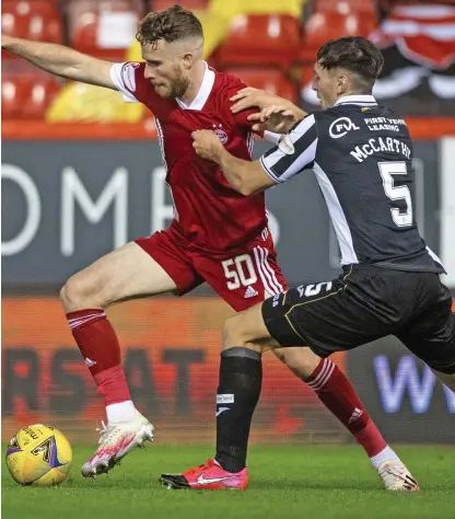  ??  ?? Battle stations: Aberdeen striker Watkins fights for possession with St Mirren’s McCarthy