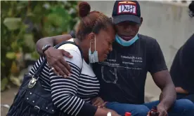  ?? Photograph: Fernando Mendez/AFP/Getty Images ?? Relatives of one of 119 convicts killed in a flare-up of gang violence at a prison wait to recover the remains of their beloved one, outside the morgue in Guayaquil at the weekend.