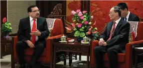  ?? (Roman Pilipey/Pool via Reuters) ?? CHINESE VICE President Wang Qishan and Medardo Gonzalez, secretary-general of the ruling party of El Salvador, meet yesterday at the Zhongnanha­i Leadership Compound in Beijing.